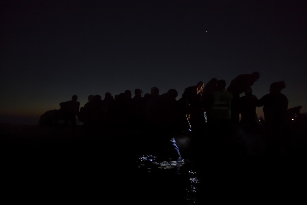 General News 2nd place. Refugees travel in darkness through Europe to avoid detection in Lesbos, Greece.