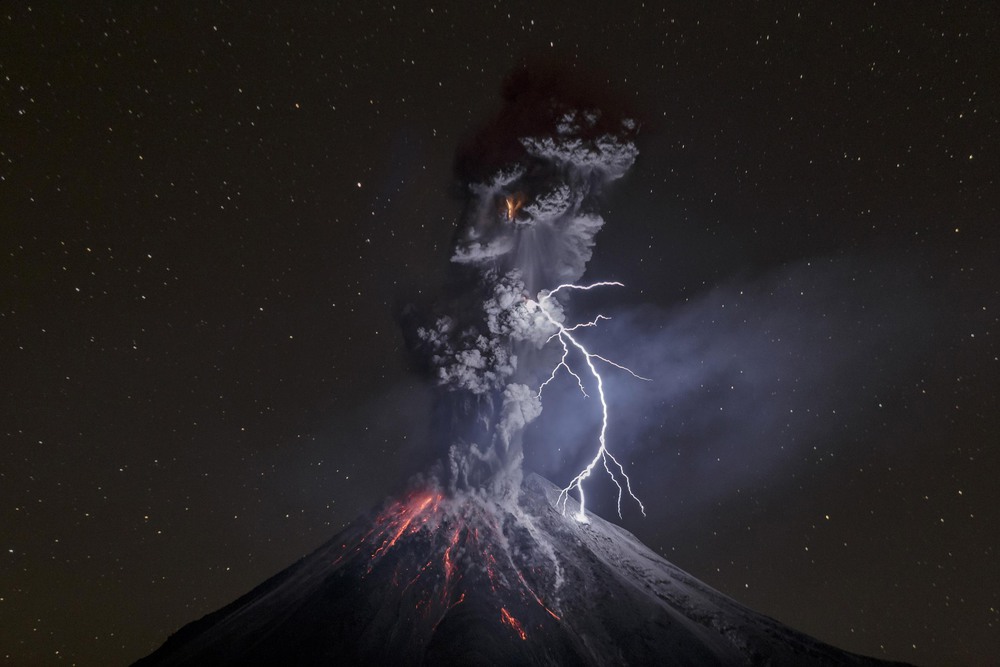 Nature 3rd place. Colima Volcano in Mexico shows a powerful night explosion with lightning, ballistic projectiles and incandescent rockfalls; image taken in the Comala municipality in Colima, Mexico.