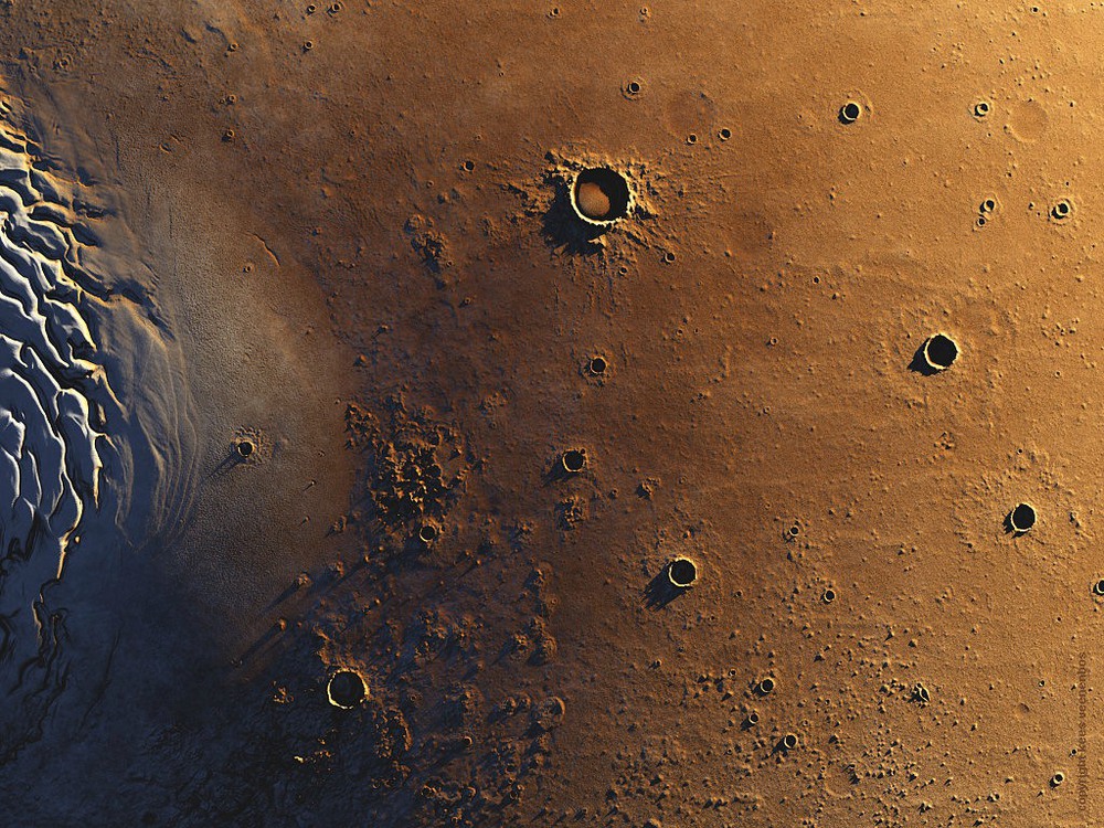 9 Mars Northpole and Vastitas Borealis

The Northpole (left) and the the Vastitas Borealis. The large crater at the top is the Korolev Crater 85 km (53 mi) in diameter. Image Credit: Data: NASA/ Art: Kees Veenenbos, www.space4case.com