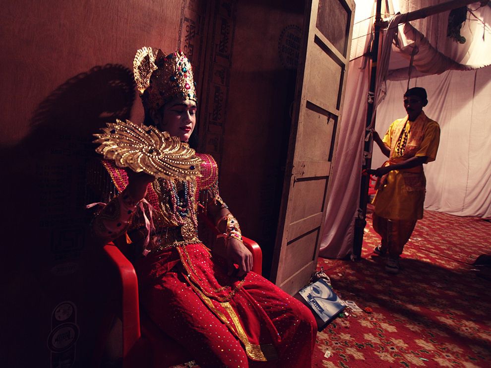 18 Act of Faith. Photograph by Mukunda De.
Your Shot member Mukunda De submitted this photo of an actor, dressed as Lord Krishna, seated backstage during a Ramlila performance in Delhi, India. The actor’s closed eyes and faint smile infer a moment of contemplation—perhaps a truly spiritual investment in his work.