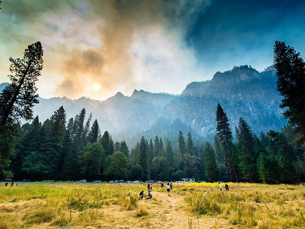 27 Go Up and Flame. Photograph by Khanh Le.
From a meadow in California’s Yosemite National Park, Your Shot community member Khanh Le snapped this photo of the smoky skyline. As the smoke rises, sunlight blazes through it, turning the haze itself a dramatic, fiery hue