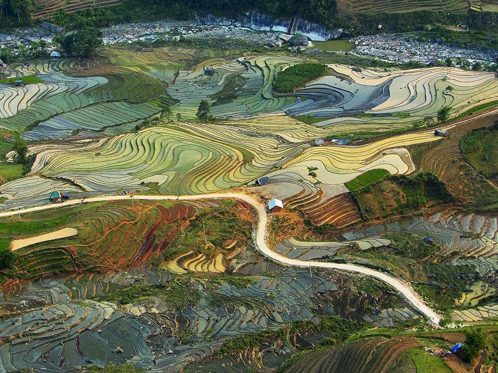 4 Painting With Land. Photograph by Tuan Guitare.  "Terraced rice fields are seen from above in Lao Cai Province in northern Vietnam. Rice is one of the country’s key exports."