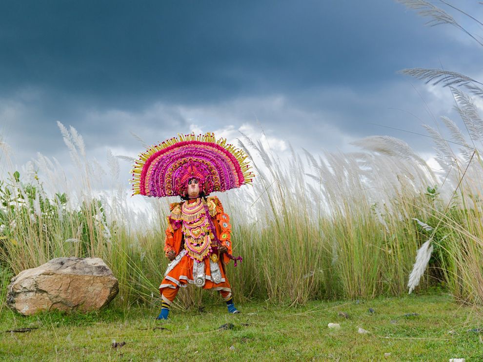 18 Chhau Dancer. Photograph by Arghya Chatterjee.      "A costumed Chhau dancer performs in Purulia in West Bengal, India. Prevalent in eastern India, the traditional martial and dramatic art comes in several forms, one of which incorporates colorful, outsize masks such as the one seen here."