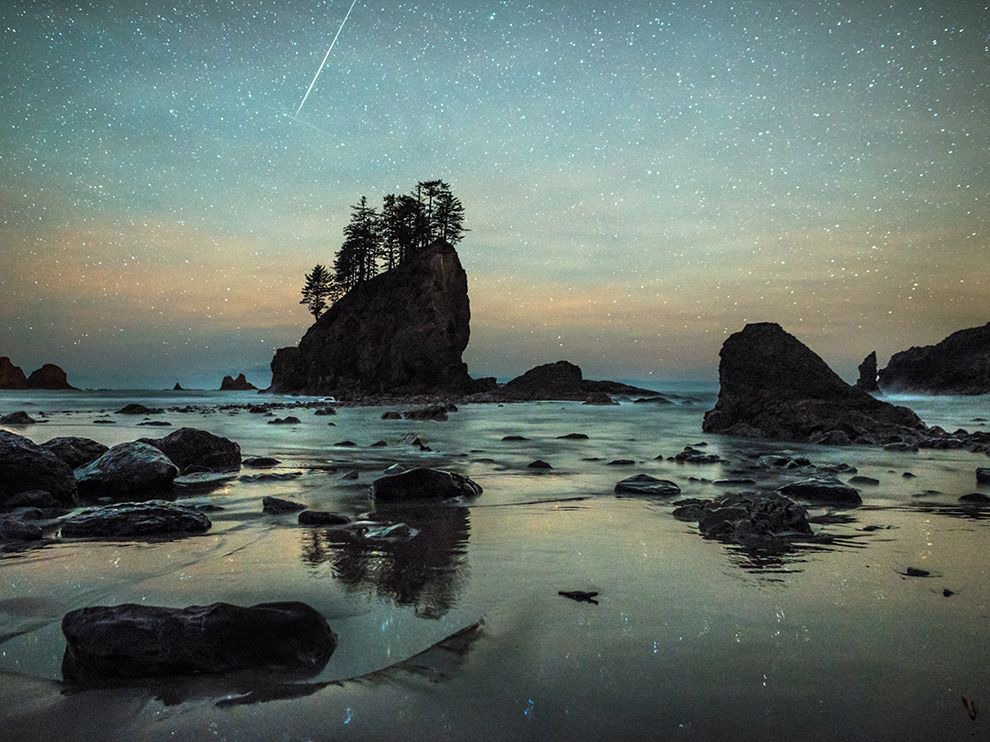 2 From Above. Photograph by Craig Goodwin. "After three days and 20 miles of hiking the beaches of Olympic National Park, I ended up on Second Beach in La Push, Washington," begins Your Shot community member Craig Goodwin, who snapped this photo of a meteor streaking across the night sky. He was looking to create images of "compositions revealed by the receding waters ... focusing on star reflections and sections of flat beach," but as it turned out, his photo opportunity came from above. "After a large wave receded, I rushed in to set up my tripod at this location ... While I watched for encroaching waves, a bright fireball ripped through the sky and into the frame. I think I might have danced a little when that happened."