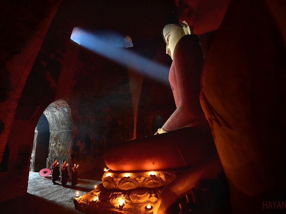 5 Reverent Light. Photograph by Jongsung Ryu. Your Shot member Jongsung Ryu, who submitted this photo, captured a solemn moment inside a temple in Myanmar: a shaft of sunlight hitting the massive Buddha statue, which overwhelms the temple's interior and dwarfs the monks, at just the right angle. "When I entered the pagoda, I found that the light gets into the tower through the window," Ryu says. "I wanted to take the photo with that light ... But it was not easy to capture a sudden moment, so I [spent] more than just one day [there]."
