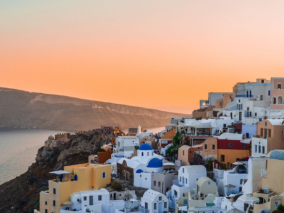 17 Painted Sky. Photograph by Soroush Etemad. While visiting Oia, on the Greek island of Santorini, Your Shot member Soroush Etemad was “mesmerized by [the] captivating beauty” of this sunset. Beneath a palette of orange and red, a large gathering of people stood on castle ruins to watch the sun go down over the Aegean Sea.