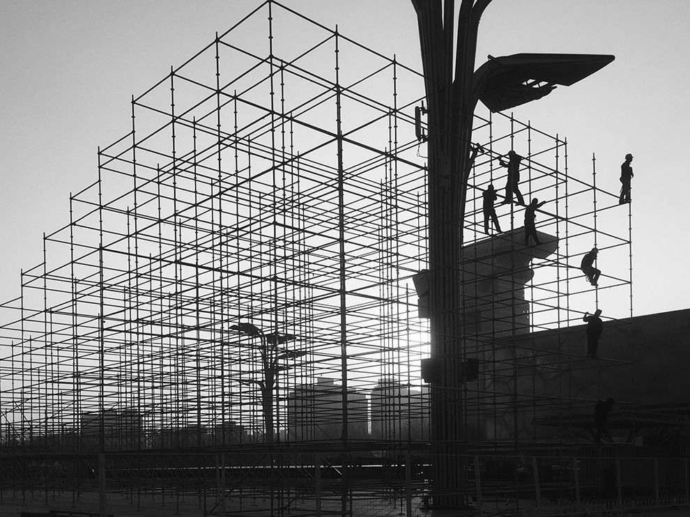 22 Setting the Stage. Photograph by Rou Yu. The 2008 Beijing Olympics brought a construction boom to the city; while it has slowed since then, the construction hasn’t ceased. Your Shot member Rou Yu came across these workers lit from behind on staging—likely erected to celebrate the Chinese New Year—between the Bird’s Nest, or Beijing National Stadium, and the Beijing National Aquatics Center, known informally as the Water Cube.