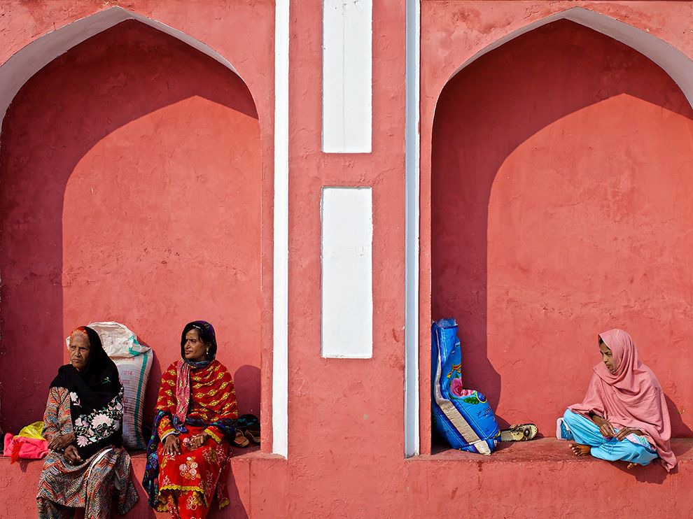 5 Box Seats. Photograph by Shah Zaman Baloch. In Lahore, Pakistan’s second largest city, something has caught the attention of these women resting against a brightly painted shrine.