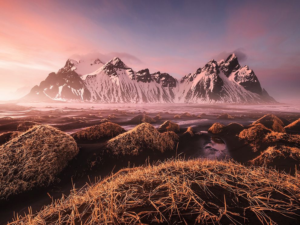 12 Rose-Tinted Spectacle. Photograph by Fabrizio Fortuna. Sunset splashes a rosy tint over the landscape in this image submitted by Fabrizio Fortuna. The mountain is the 1,500-foot (457-meter) Vestrahorn, a main landmark of southeastern Iceland.