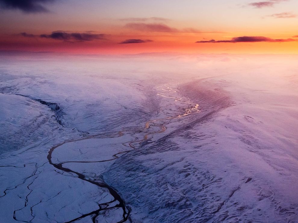 16 Fire and Ice. Photograph by Konrad Kulis. A dramatic sunset colors Iceland’s landscape and sky. Your Shot member Konrad Kulis captured this aerial shot while “en route to the volcano Holuhraun,” he writes. The volcano, which last erupted in 2014, is located just north of the expansive, 3,200-square-mile (8,400-square-kilometer) Vatnajӧkull, or Vatna Glacier.