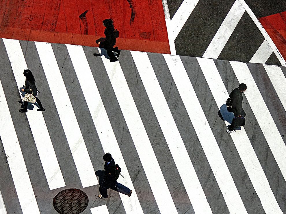 28 Crossing the Lines. Photograph by José Hernán Cibils. Pedestrians make their way across an intersection in Tokyo. Given the crowded intersections the city is known for, this crossing looks like a breeze.