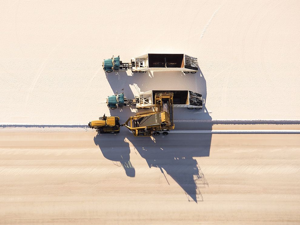 30 Precious Mineral. Photograph by Jassen T. A harvesting machine gathers salt from a crystallizing pond near the Great Salt Lake in Utah. The briny lake is the largest lake west of the Mississippi River and is so salty that much of the aquatic life found in other lakes cannot live there.