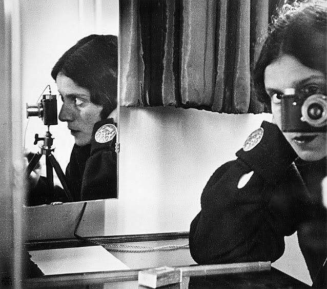 27 Ilse Bing, a self portrait in the mirror, 1931.