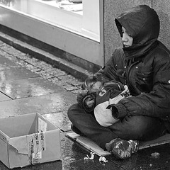 Little beggar with a dog